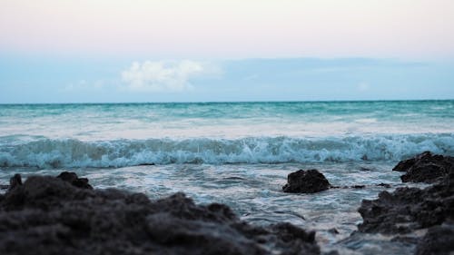 Close-Up Of Waves Breaking In The Rocks