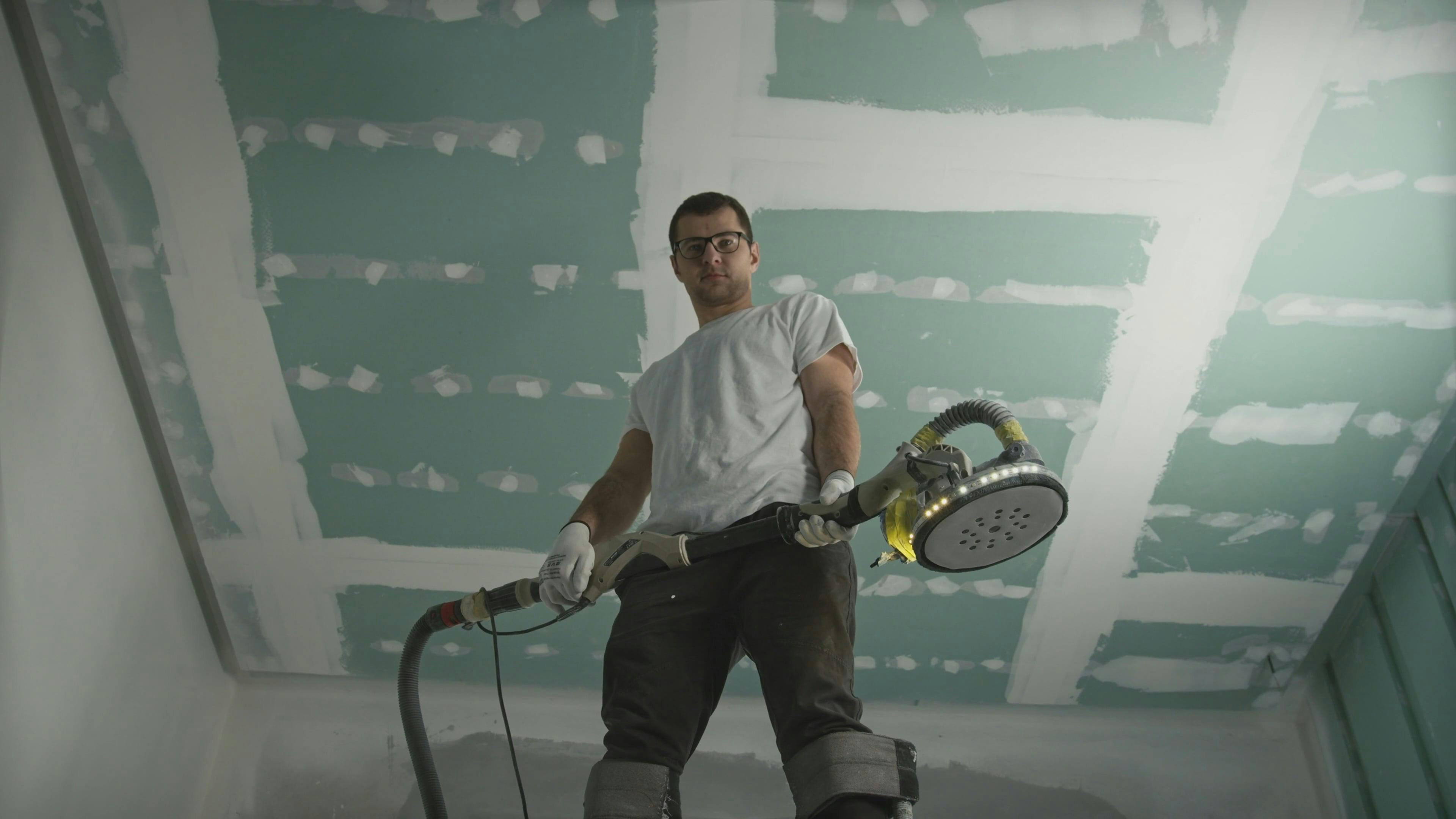 Man Posing with Polishing Machine · Free Stock Video