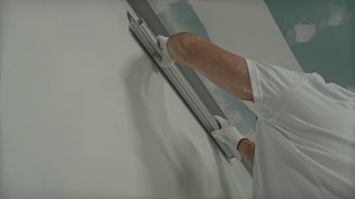 Man Applying Wall Putty