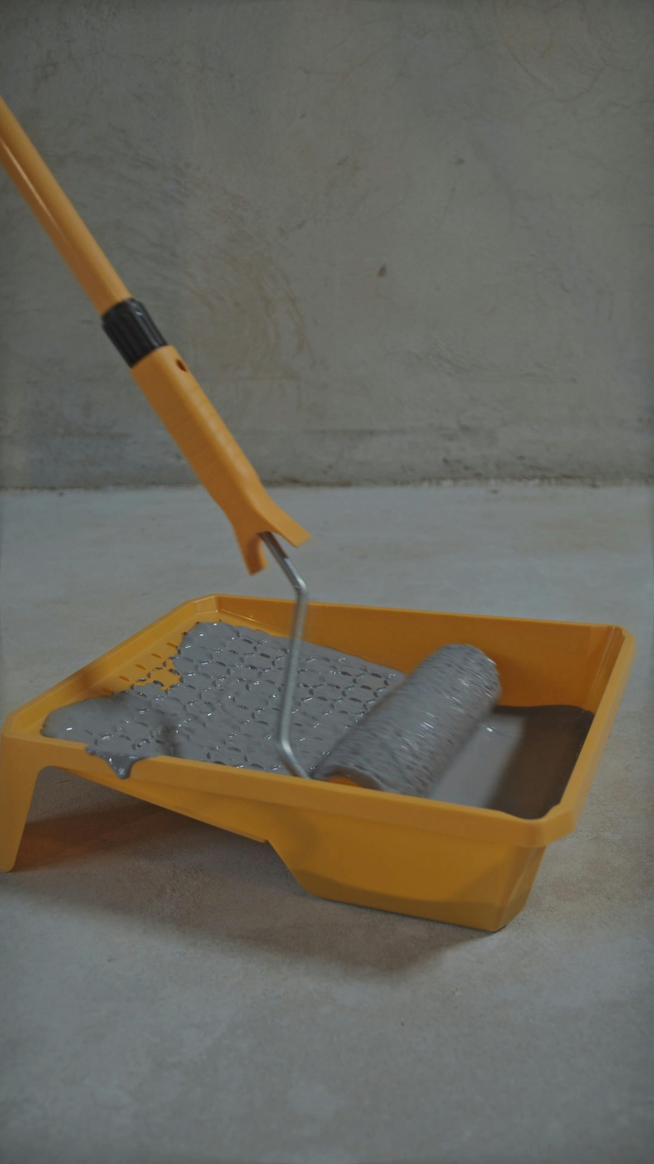 Removing Excess Paint from Paint Roller · Free Stock Video