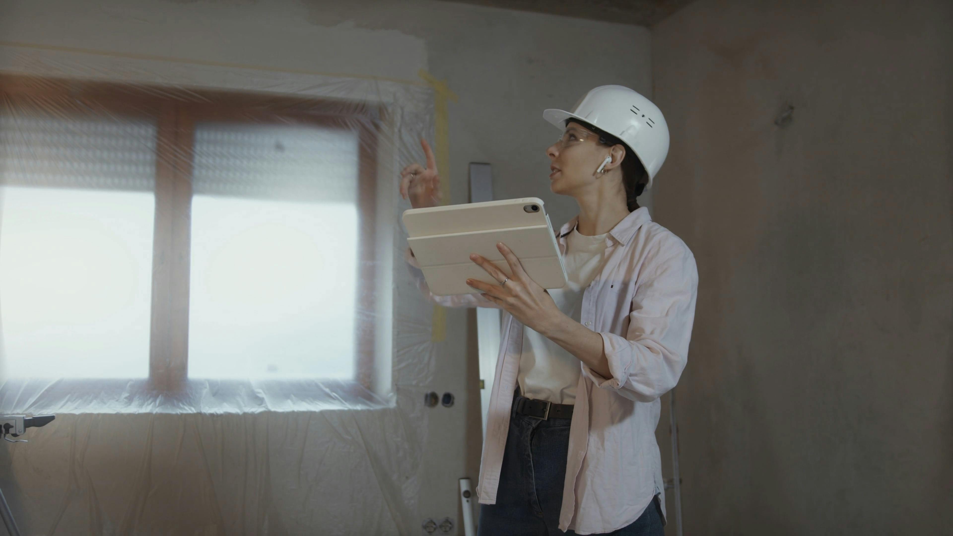 Woman Renovating Home and Using Tablet \u00b7 Free Stock Video
