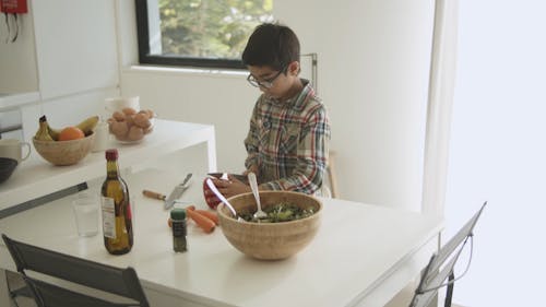 A Boy Cutting Bell Pepper