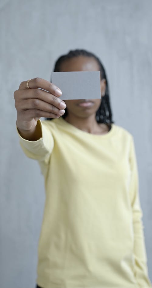 Woman Holding Blank Gray Card