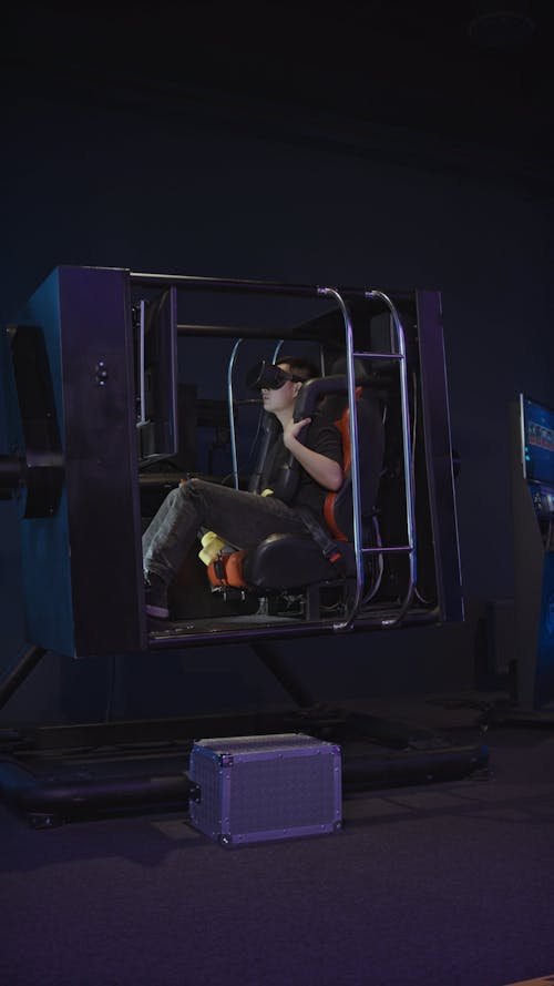 Person Playing Virtual Reality Simulator