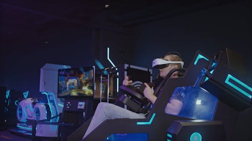Man Playing Video Game In Virtual Reality Mode