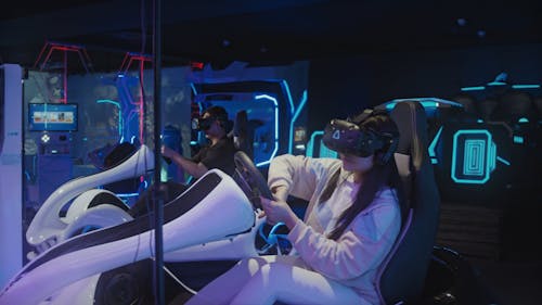 People Playing Driving Simulator