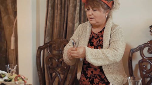 A Woman Serving Food at a Christmas Dinner