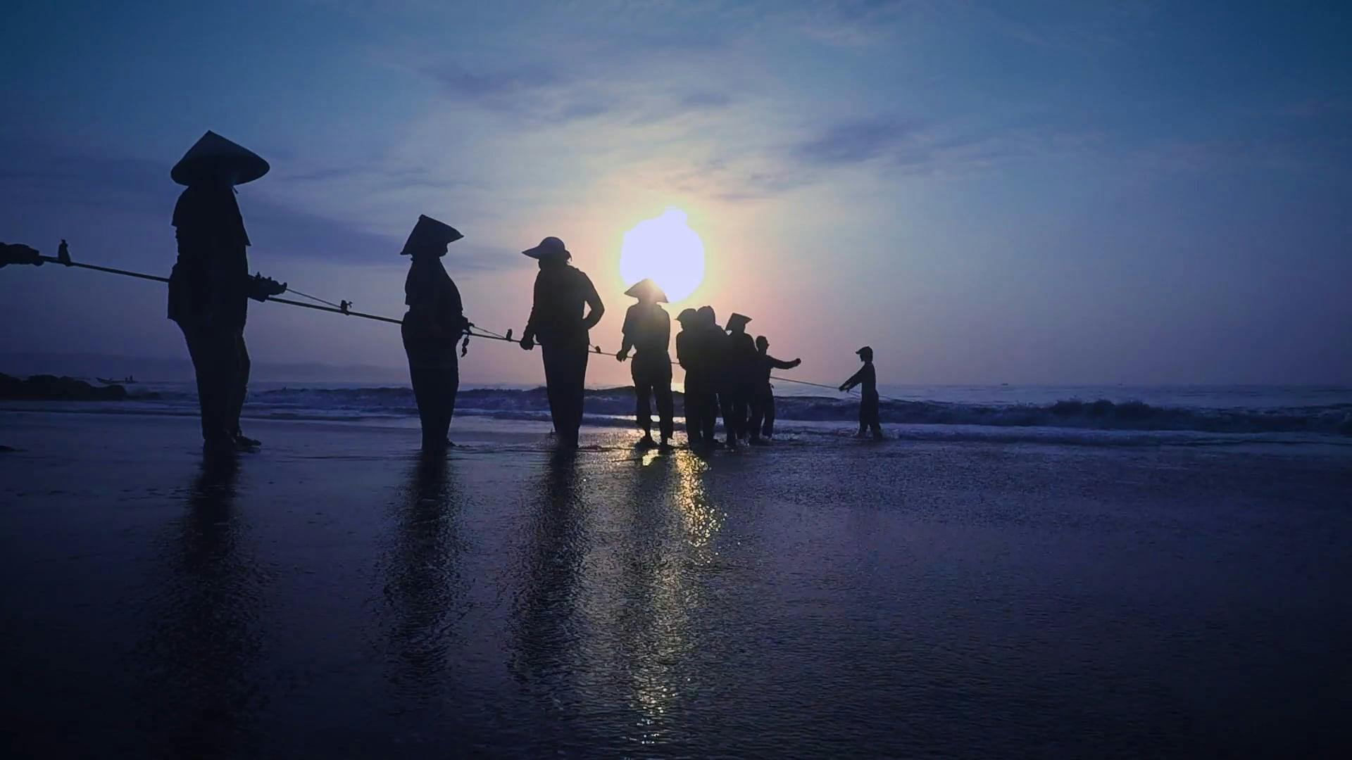 People Pulling a Rope From the Sea · Free Stock Video