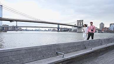 people holding hands while walking