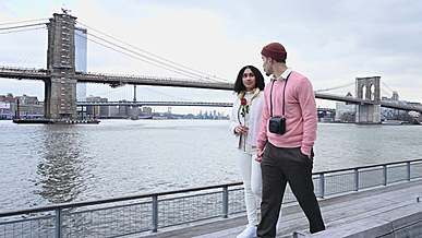 couple kissing while walking