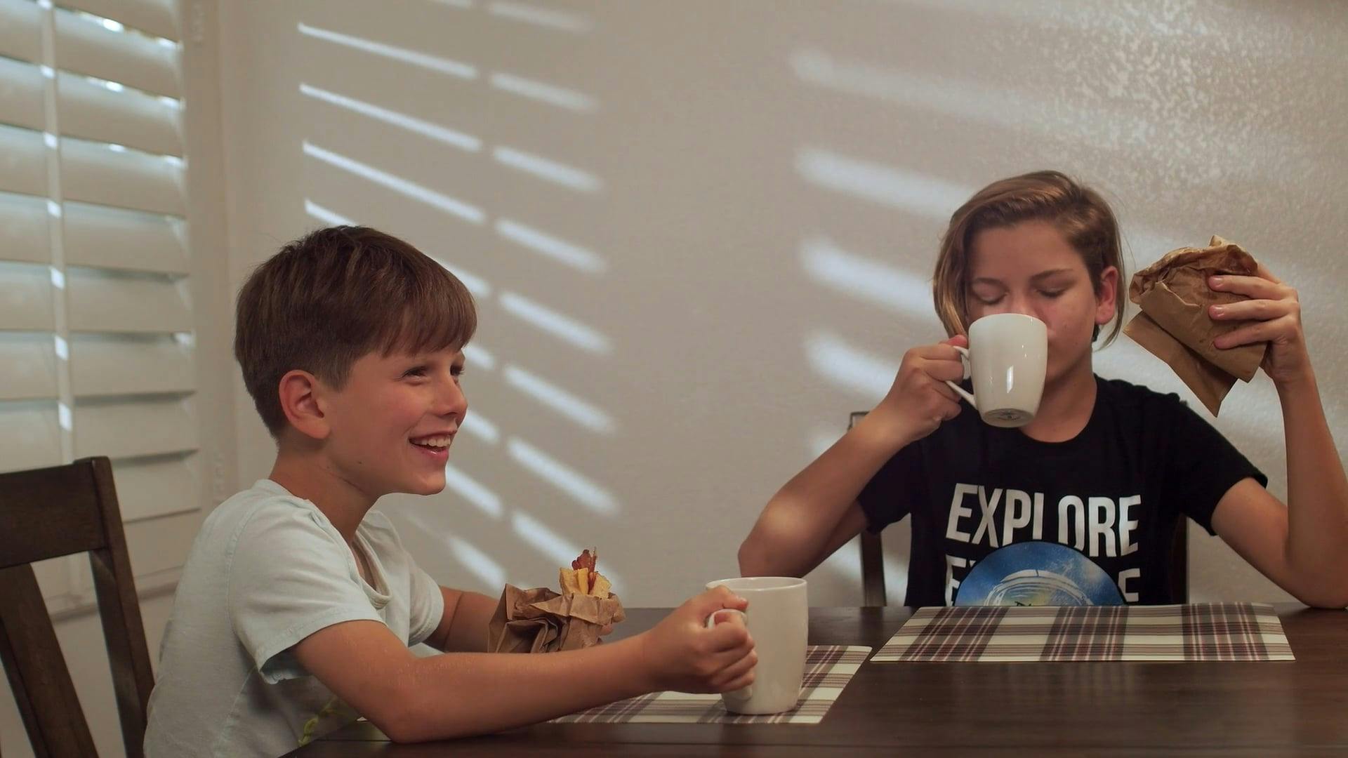 Young Boys Exchanging Breakfast Sandwiches at Home · Free Stock Video