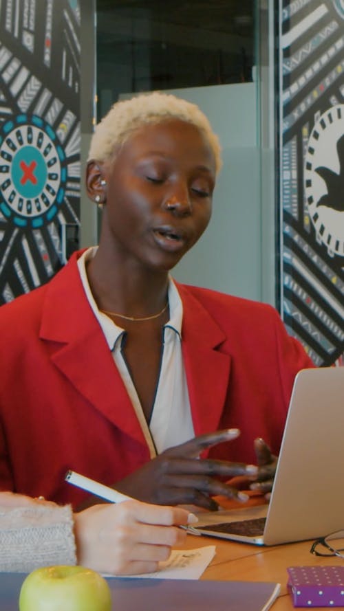 A Woman Talking and Laughing at an Office