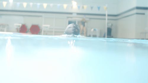 A Man Swimming in the Pool