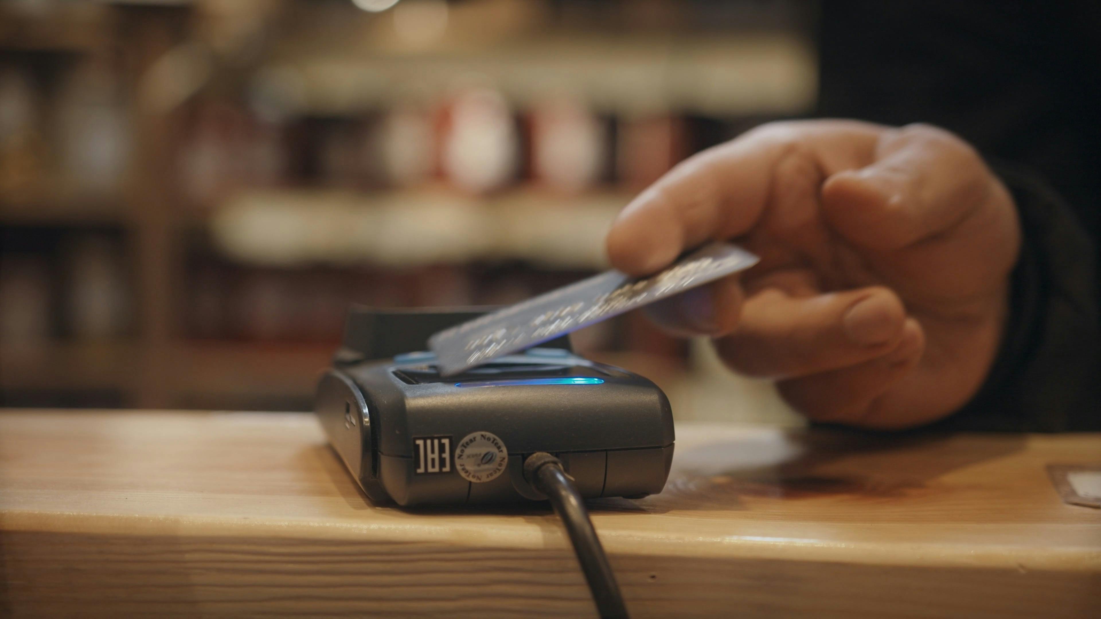 A Man Tapping a Credit Card on a Terminal · Free Stock Video