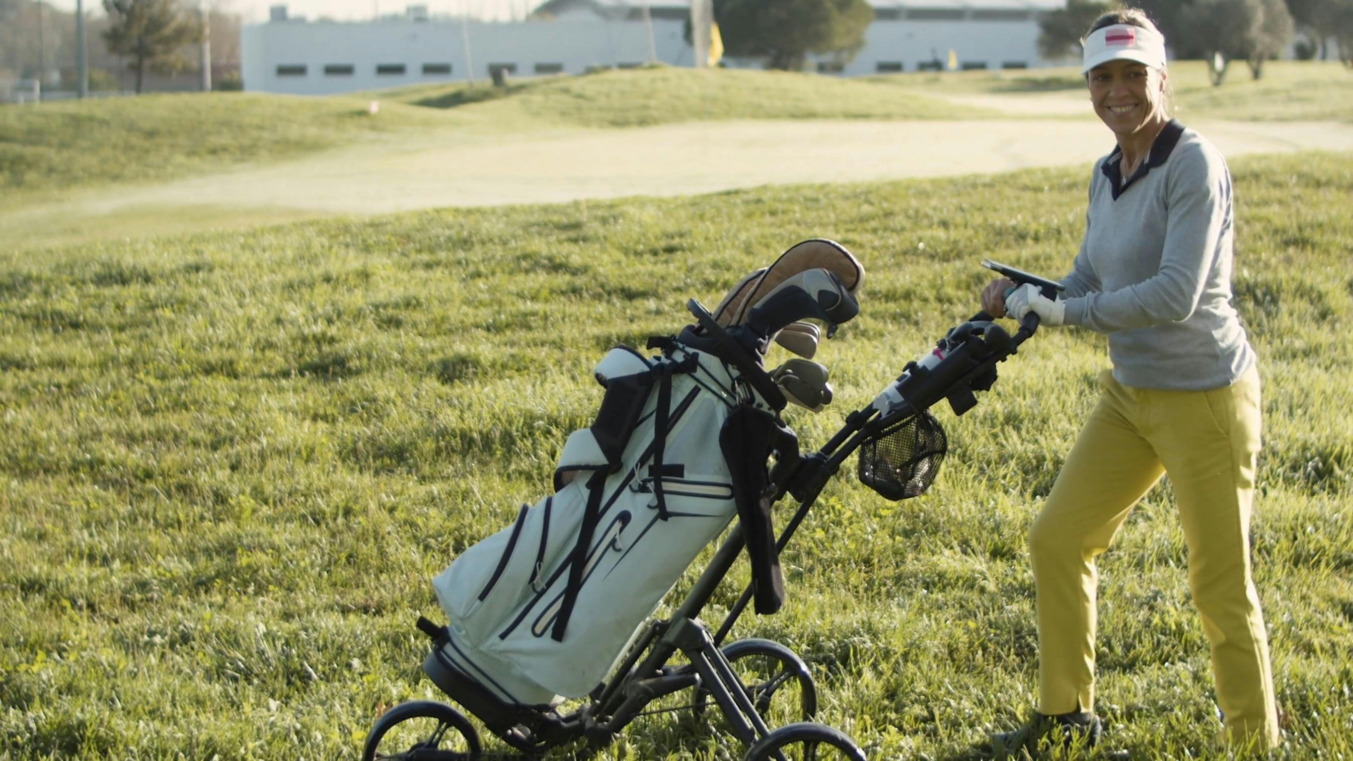 A Woman Pushing Her Golf Bag · Free Stock Video