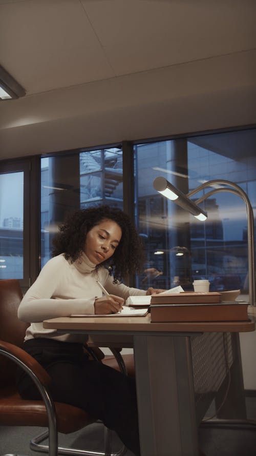 College Students Researching and Reading at the Library