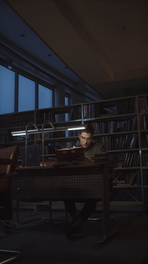 A Man Studying at the Library