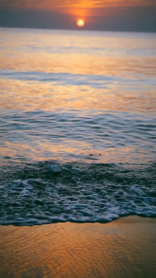 Sea Waves Under Sunset