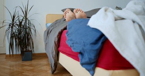 A Woman Getting Off Her Bed