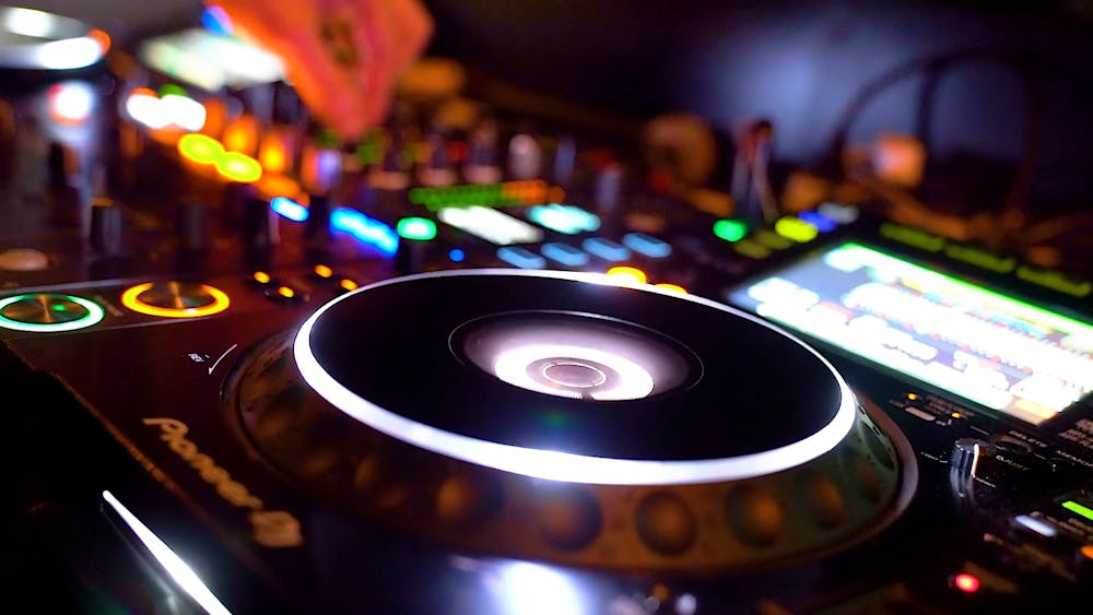Close-up View Of A Dj's Turntable And Audio Mixer · Free Stock Video