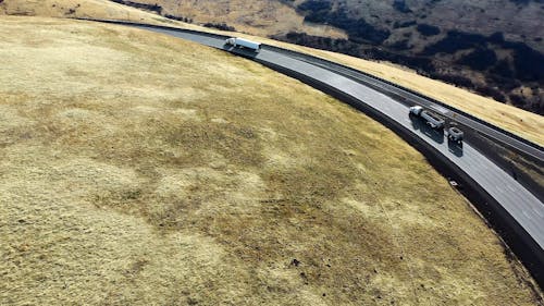 Aerial Shot of Motor Vehicles Passing By the Road