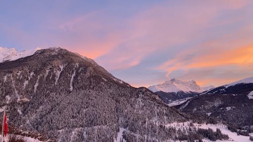 Golden Sunset Over Snow Covered Mountains