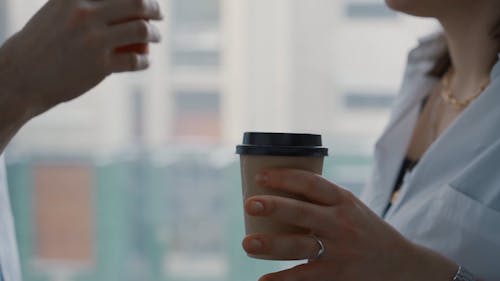 Close Up Video of People Holding a Cup