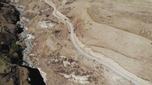 Aerial Footage Of Road Beside The Hill