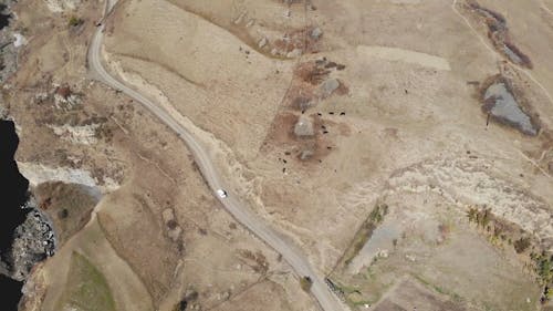 Aerial Footage Of Road Beside The Hill