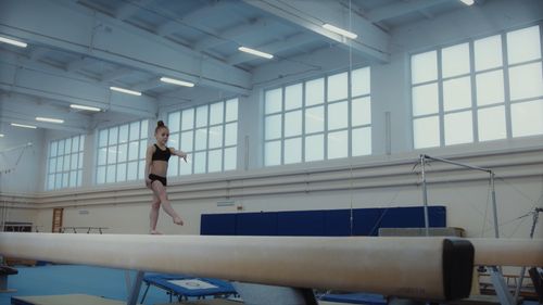 A Girl Practicing On The Balance Beam Free Stock Video a-girl-practicing-on-the-balance-beam-free-stock-video