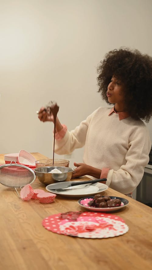 Woman Preparing the Chocolate Ingredient for Baking