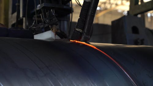 Machine Cutting a Metal Pipe