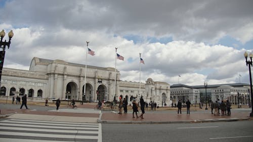 Pedestrians in Front of Historical Building