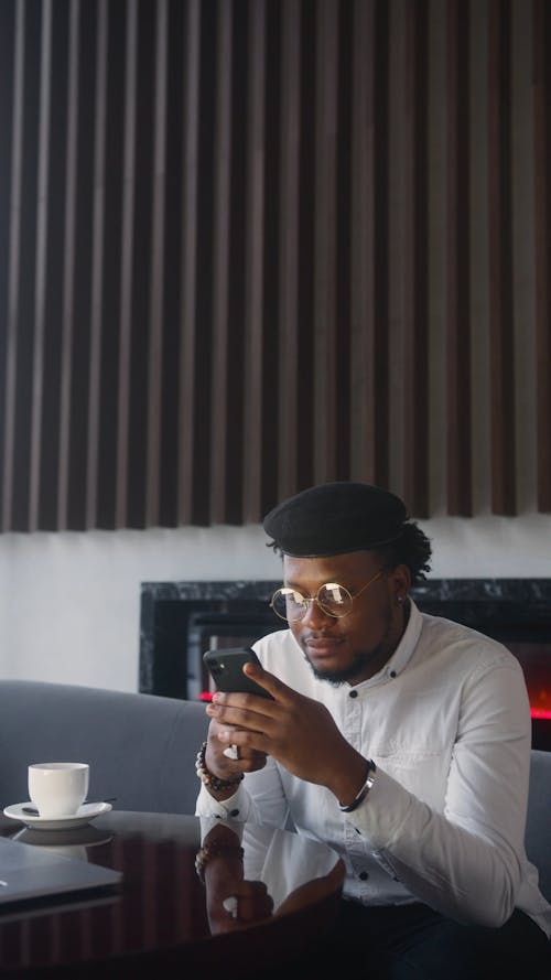Man Wearing Eyeglasses Using Cellphone