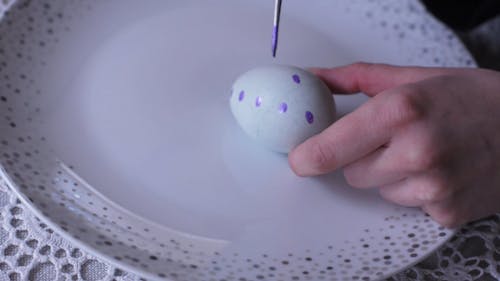 Crop Person Painting an Eggshell