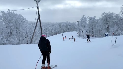 People Skiing in the Mountain