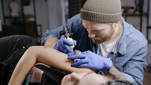 A Man Tattooing