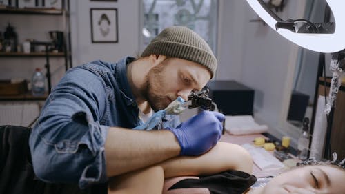 A Man Tattooing