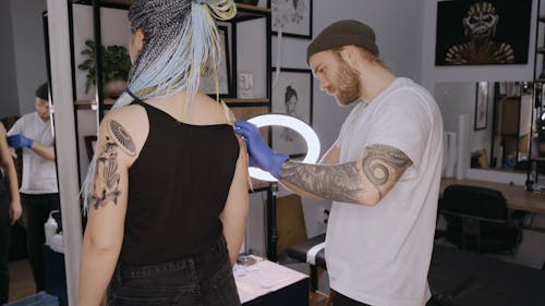 A Man Preparing for a Tattoo Session
