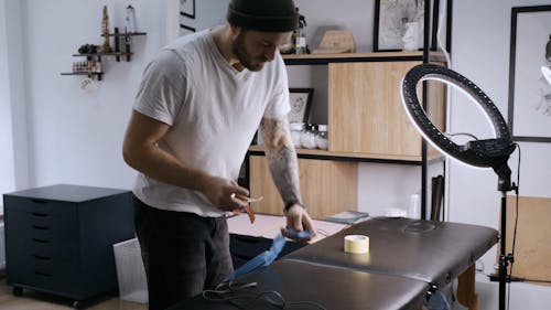 Tattoo Artist Preparing Equipment for Session