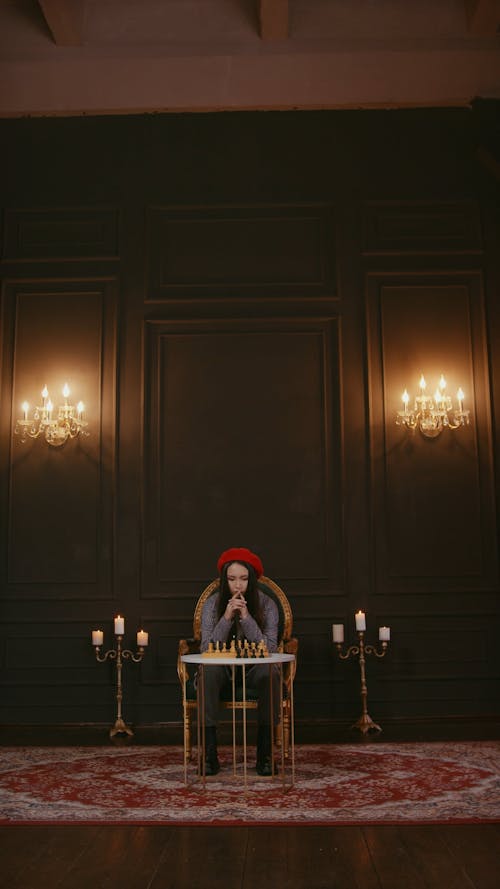 Woman Playing Chess Alone