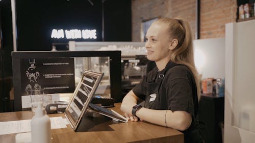 Slow Motion Video of a Woman at the Counter