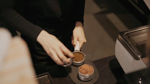 Barista Using a Coffee Tamper