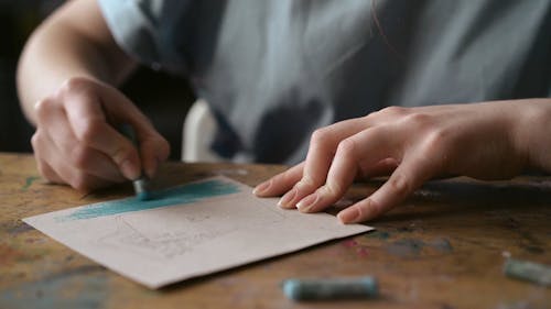 Person Painting In Crayons