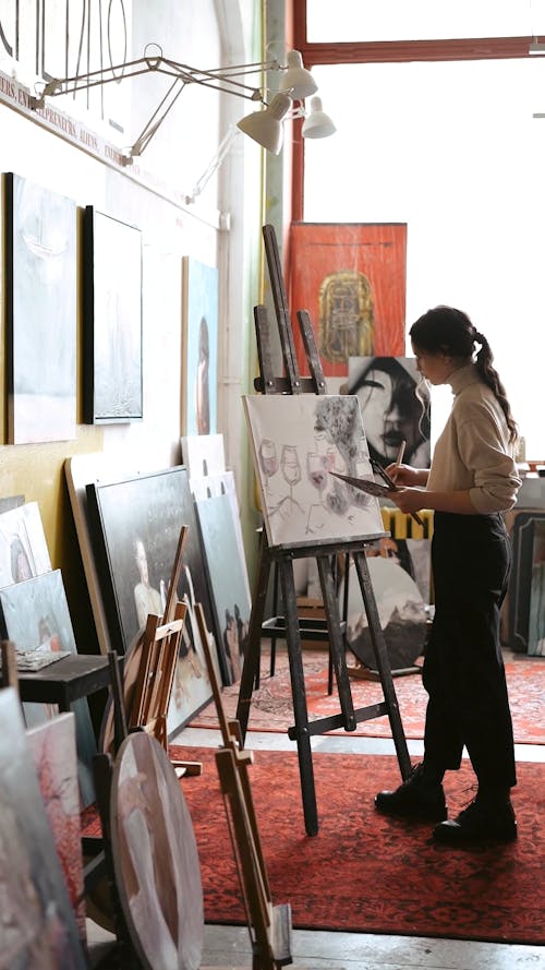 Woman Painting while Standing