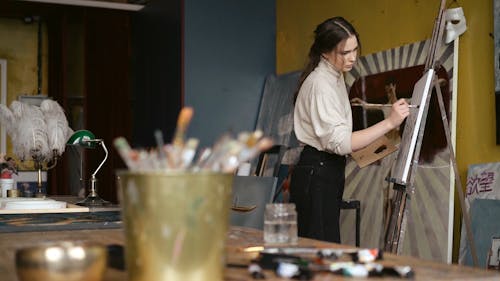 A Woman Painting on a Canvas