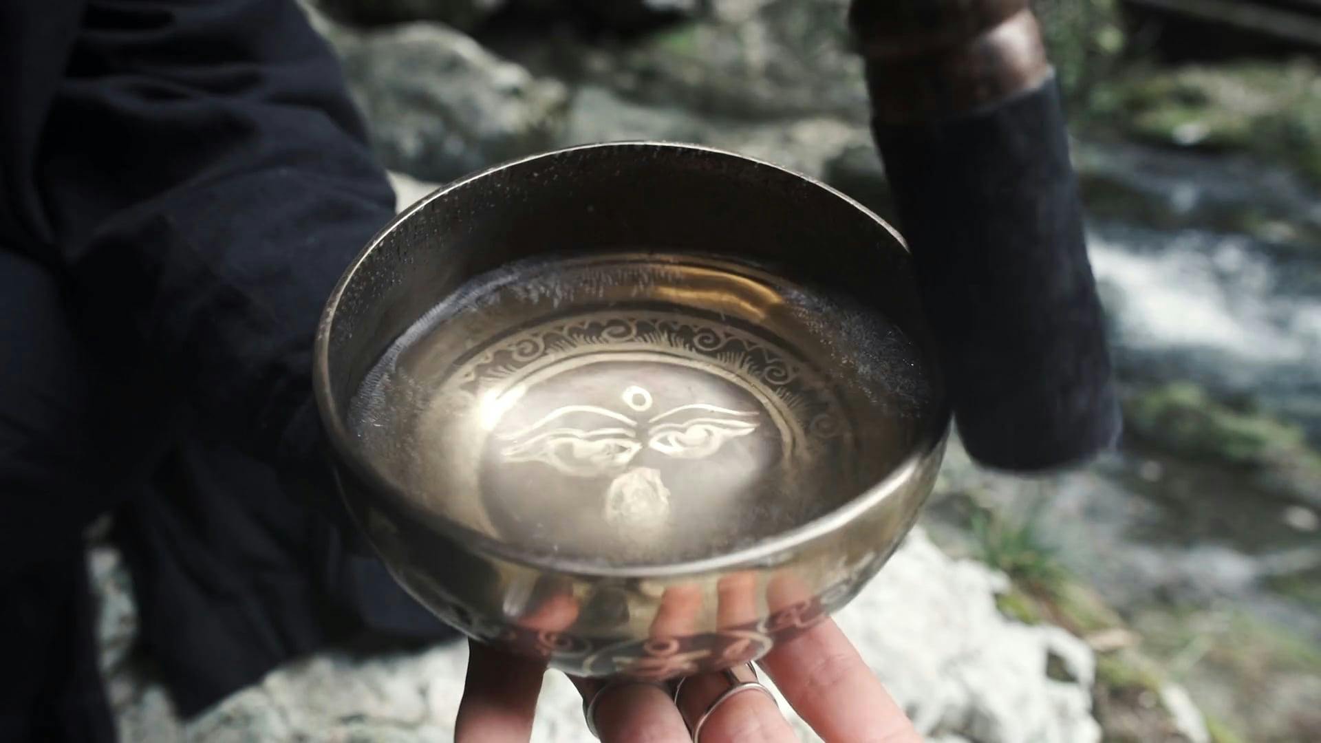 Tibetan Singing Bowl with Water Inside Free Stock Video Footage