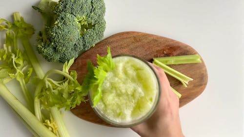 Putting Celery Shake on Top of Cutting Board