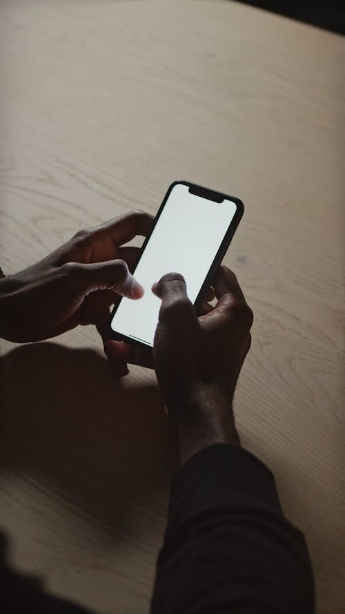 Male Hand Typing On Mobile Phone