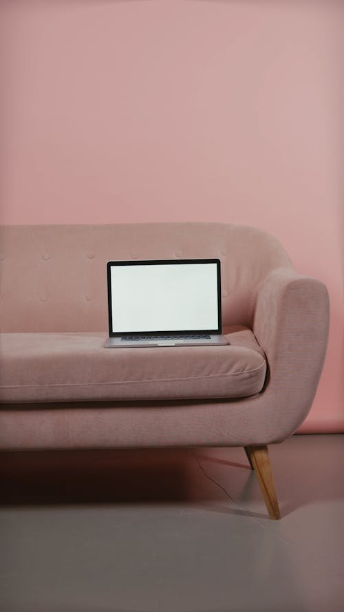 A Laptop Placed on a Couch